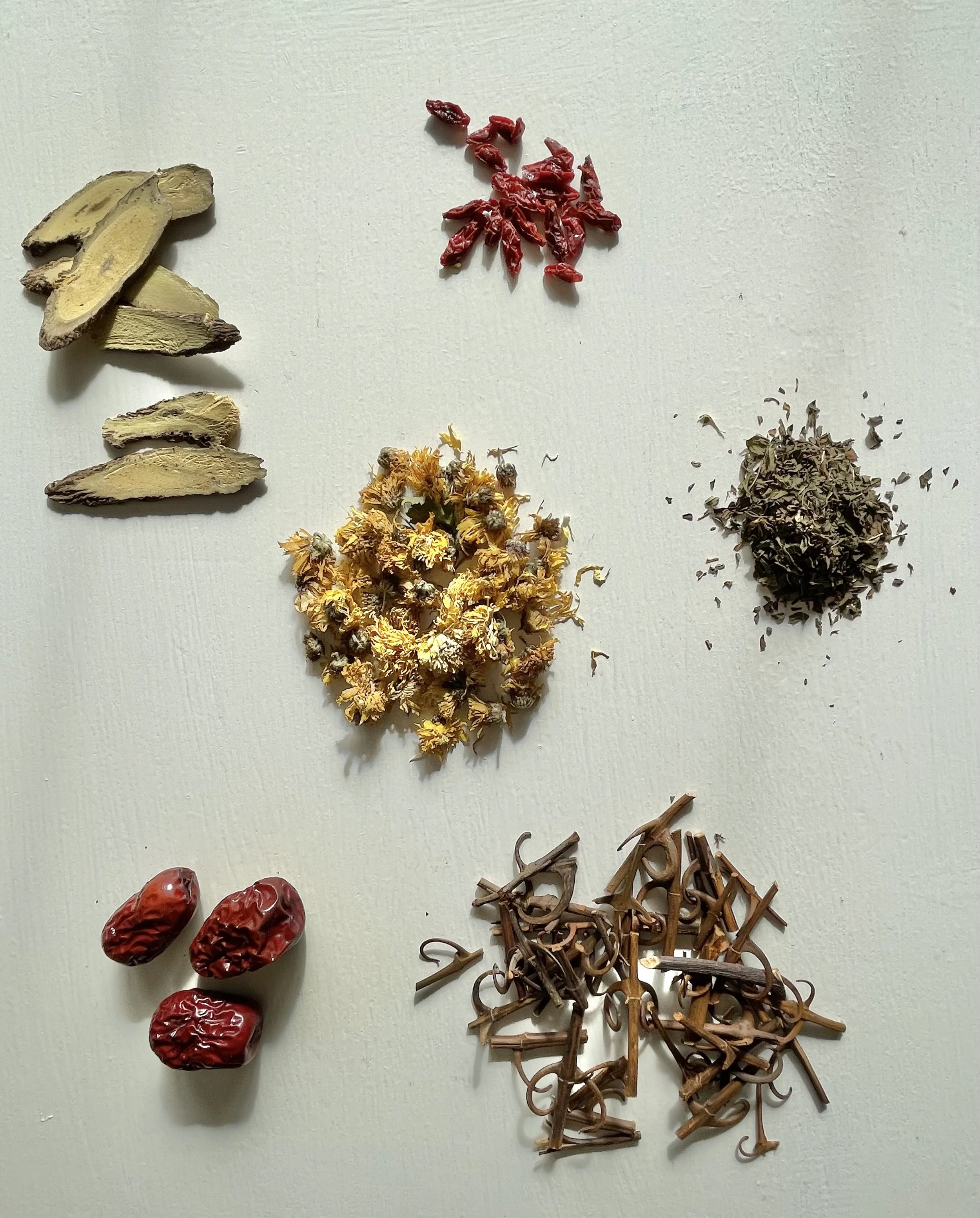 Traditional herbs arranged on a clinic table.